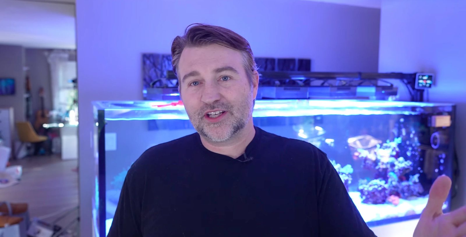 Reef Dudes on YouTube, in front of a reef aquarium